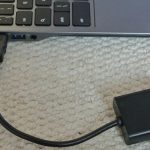 laptop connected with hdmi to vga adapter
